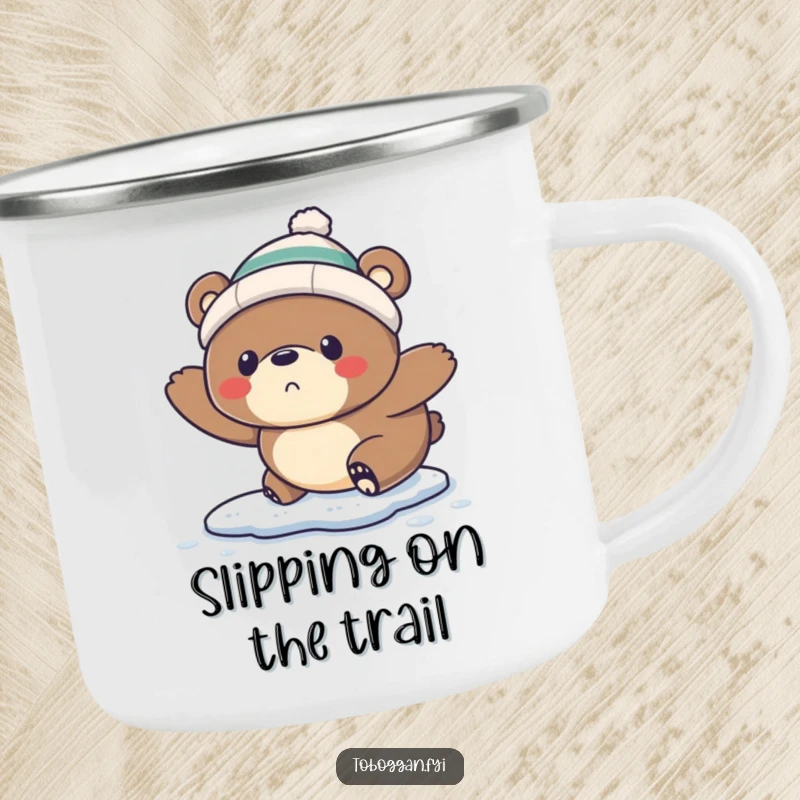 Funny Camping Mug: A startled bear wearing a tiny toque comically slips on ice, perfect for outdoor enjoyment.