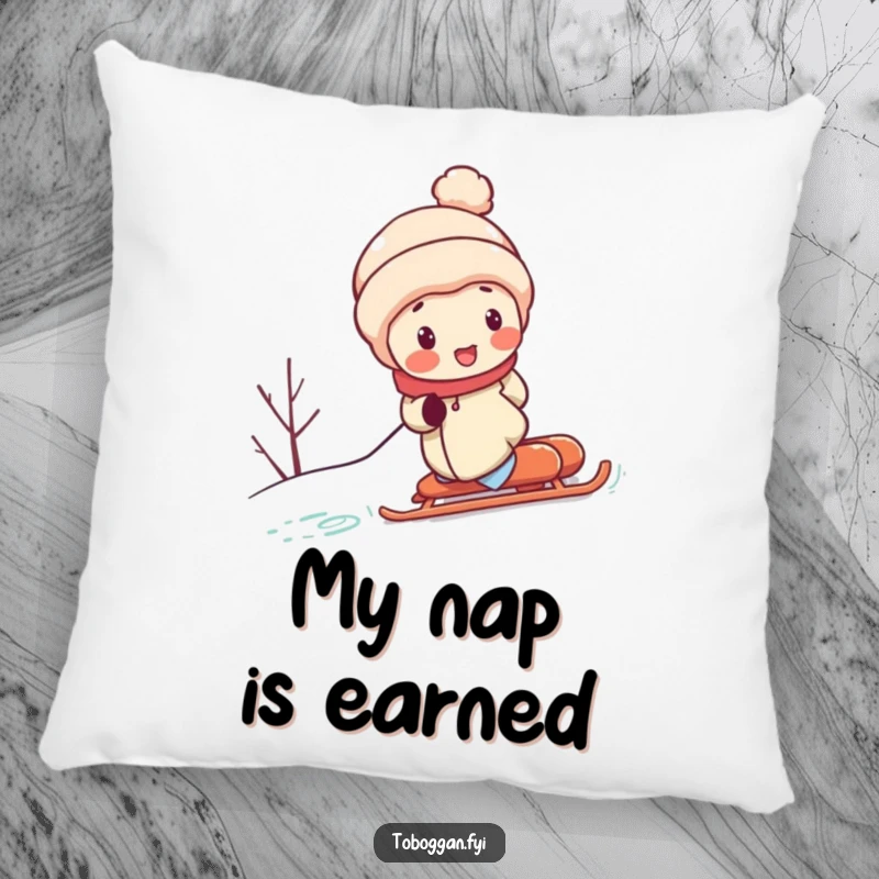 Funny pillow showcases a cute character with rosy cheeks, struggling to push a sled up a snowy hill, offering humorous comfort and winter charm.