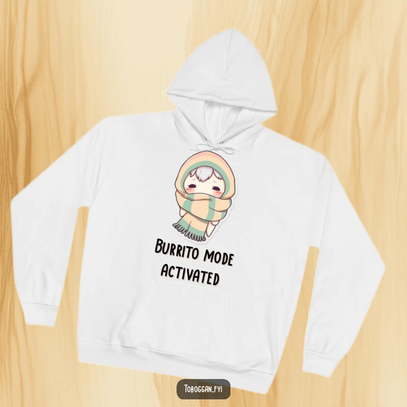 Funny hoodie showing a character comically bundled up in a giant scarf, peeking out with mischievous eyes.