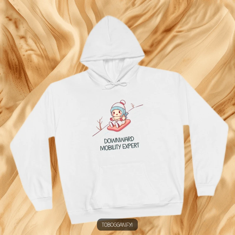 Funny hoodie featuring a cute cartoon character gleefully sliding down a snowy hill, perfect for staying warm and cheerful.