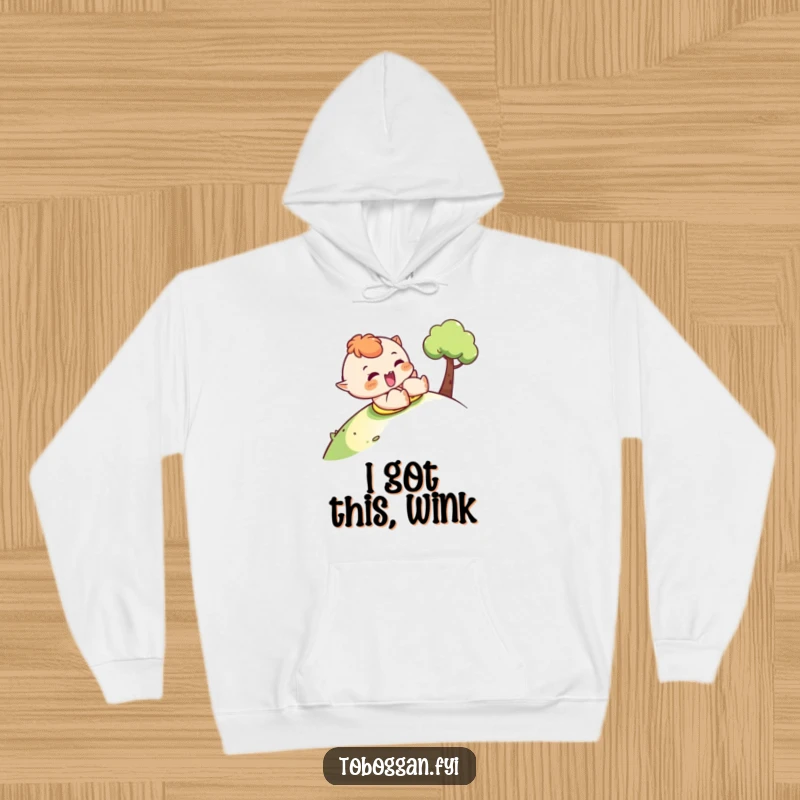 Funny sledding hoodie featuring a character sliding downhill with a cheeky wink, perfect for cozy winter days.