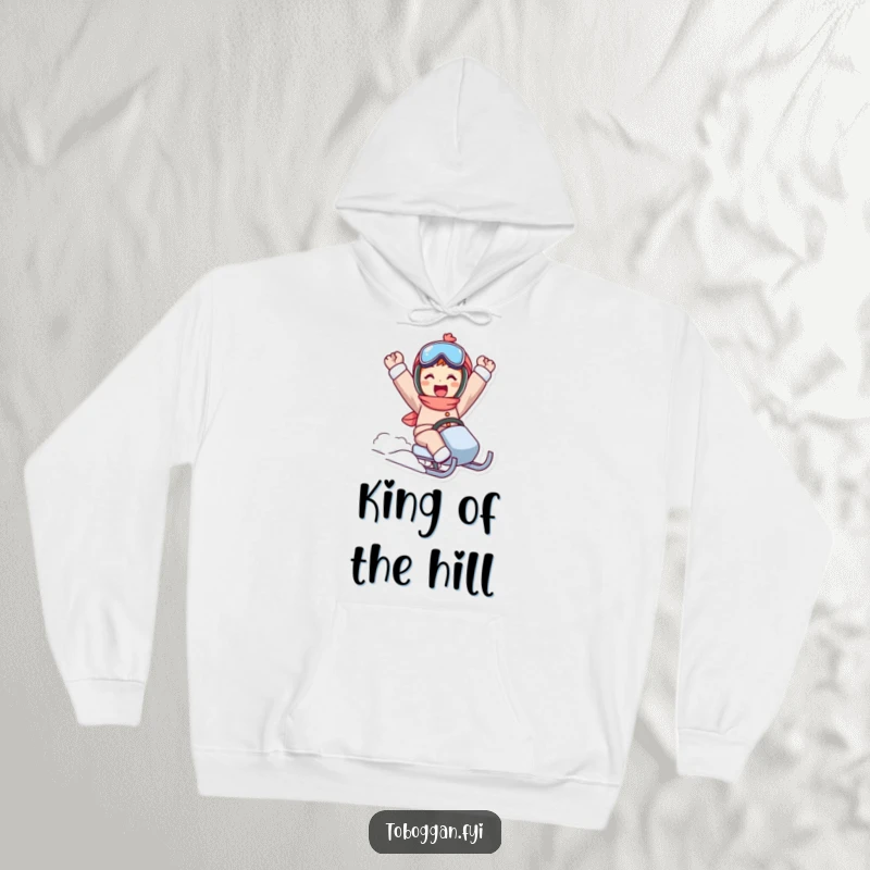 Funny sled ride hoodie showcasing a character in a triumphant pose, celebrating a successful winter activity.