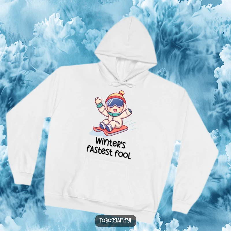 Funny hoodie depicting a character joyfully waving while sledding downhill, offering warmth and a humorous, energetic vibe.