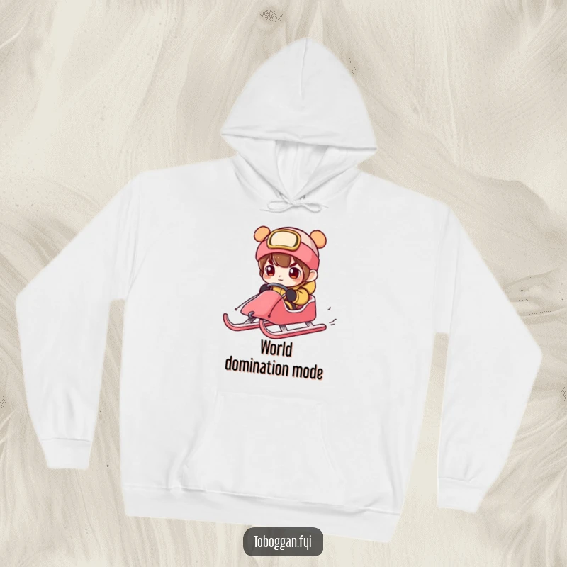 Funny character intensely concentrating on steering a sled down a snowy slope, featured on a warm and humorous hoodie.