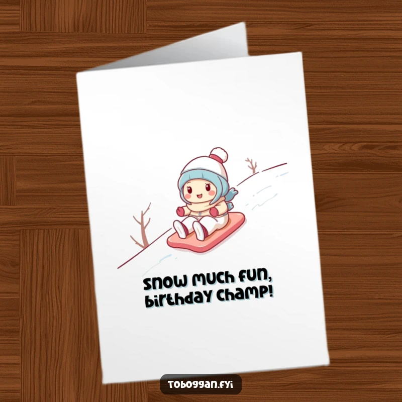 Funny Free Printable Birthday Card: Cute cartoon character gleefully sliding down a snowy hill, bringing winter joy.