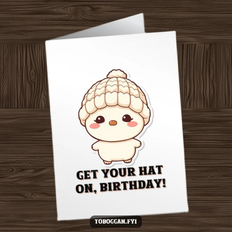 Funny free printable birthday card: a character with a mischievous grin wearing a tiny wool hat, plotting birthday fun.