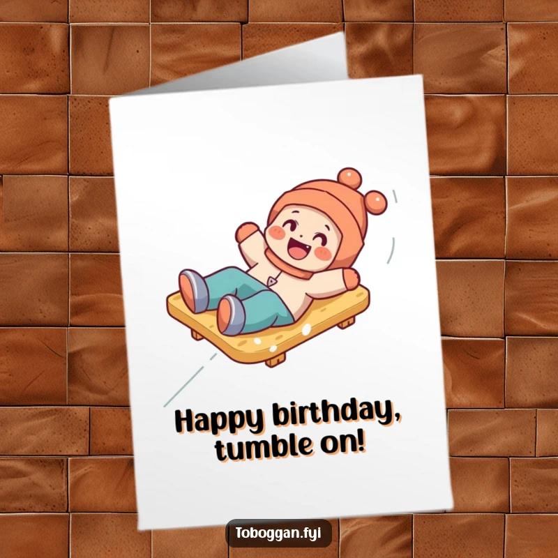 Funny Free Printable Birthday Card: Character playfully tumbling off a toboggan, capturing a moment of chaotic fun.