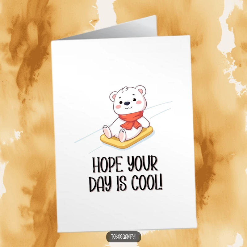 Funny Free Printable Birthday Card: Cheerful polar bear cub in a scarf slides down an icy slope, a cute downloadable gift.