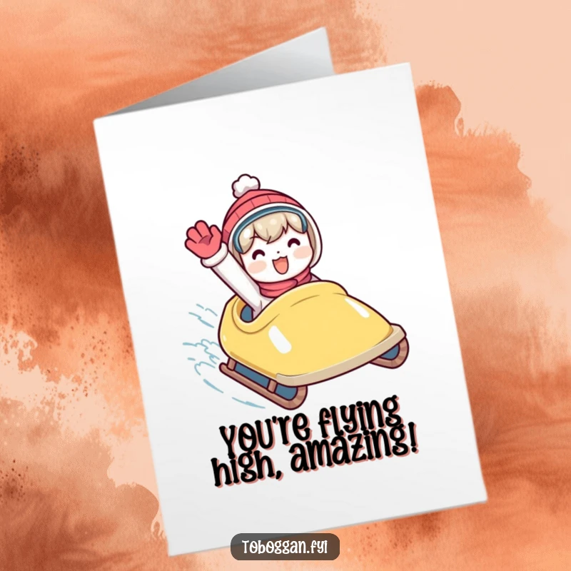 Funny Free Printable Congratulations Card: Character waving enthusiastically from a speedy toboggan. An exuberant downloadable cheer.