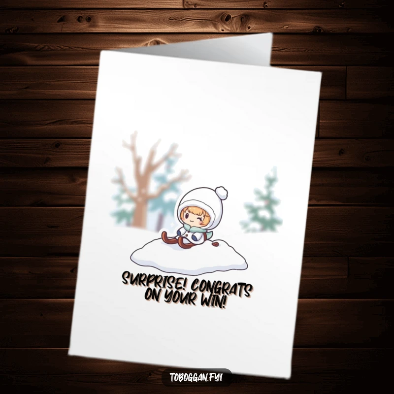 Funny Free Printable Congrats Card: A character bursts from a snowy sled pile, delivering congratulations with a playful winter theme.