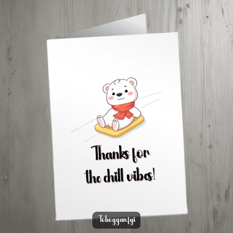 Funny Free Printable Thank You Card: A cheerful polar bear cub wearing a scarf sliding downhill, a cute downloadable message.