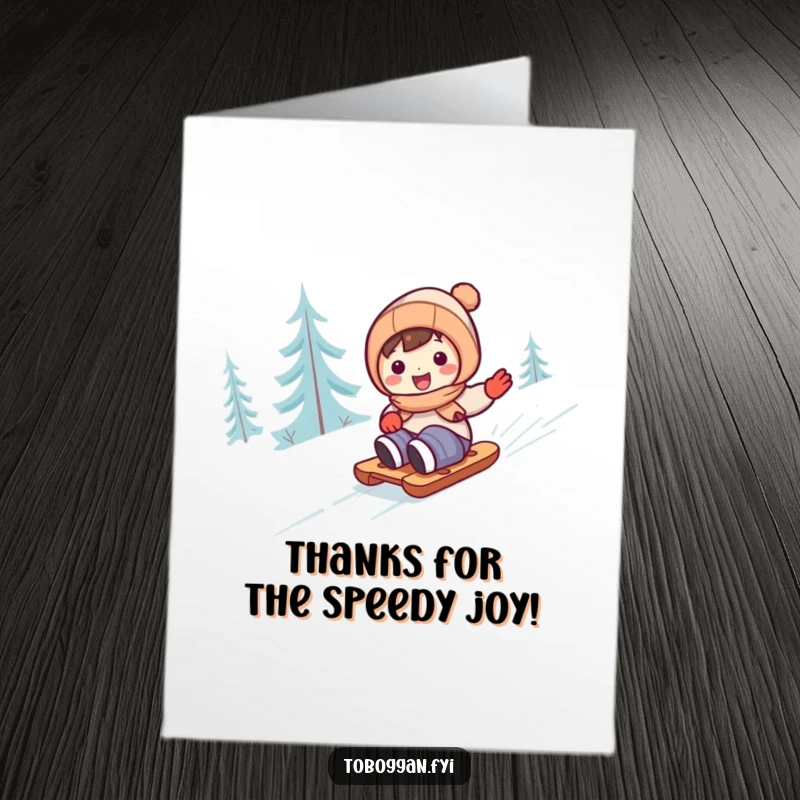 Funny Free Printable Thank You Card: Cute character happily sledding down a snowy hill.