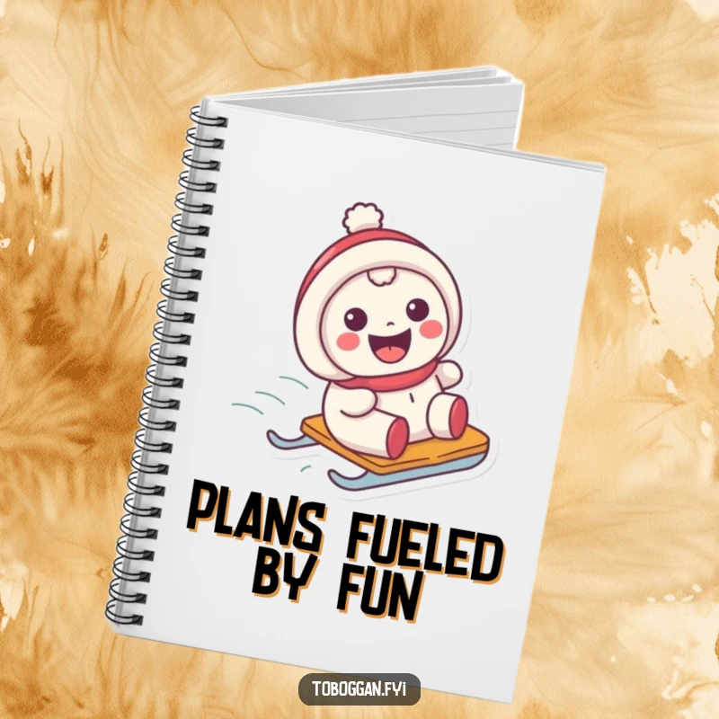 Funny notebook with a character showing a big grin while sliding on a sled, ideal for notes and doodles.