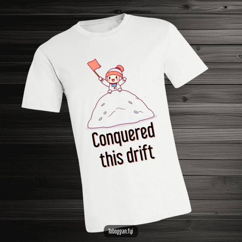 Funny t-shirt featuring a character holding a small flag, cheering victoriously from the top of a snowdrift, exuding joy and accomplishment.