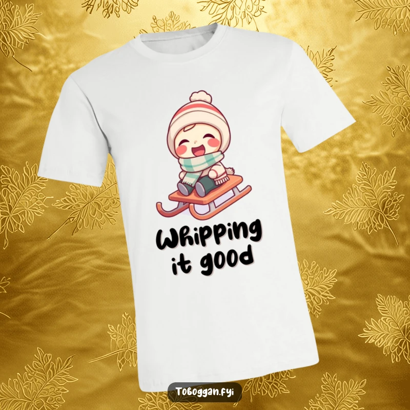 Funny character wearing a tiny scarf laughs while their sled spins on a t-shirt.