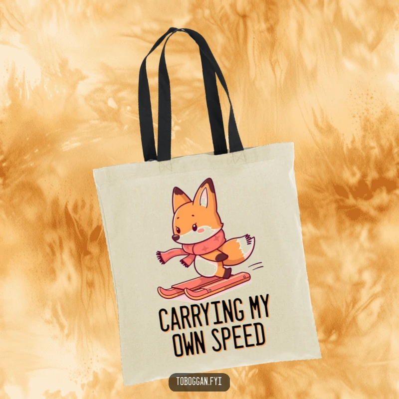 Funny tote bag featuring a determined fox in a scarf, comically chasing a runaway toboggan, for a humorous touch.