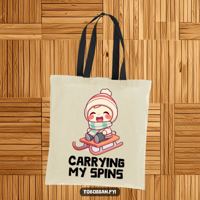 Funny character wearing a tiny scarf laughs as their sled spins on a tote bag.