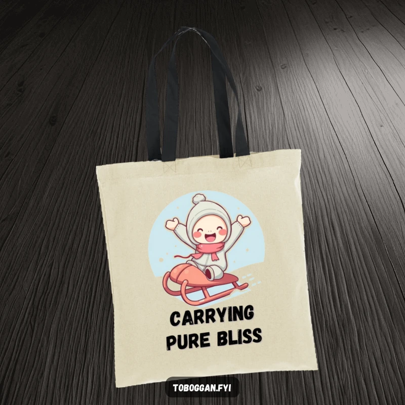 Funny tote bag depicting a cute character with rosy cheeks joyfully jumping from a sled, perfect for carrying essentials.