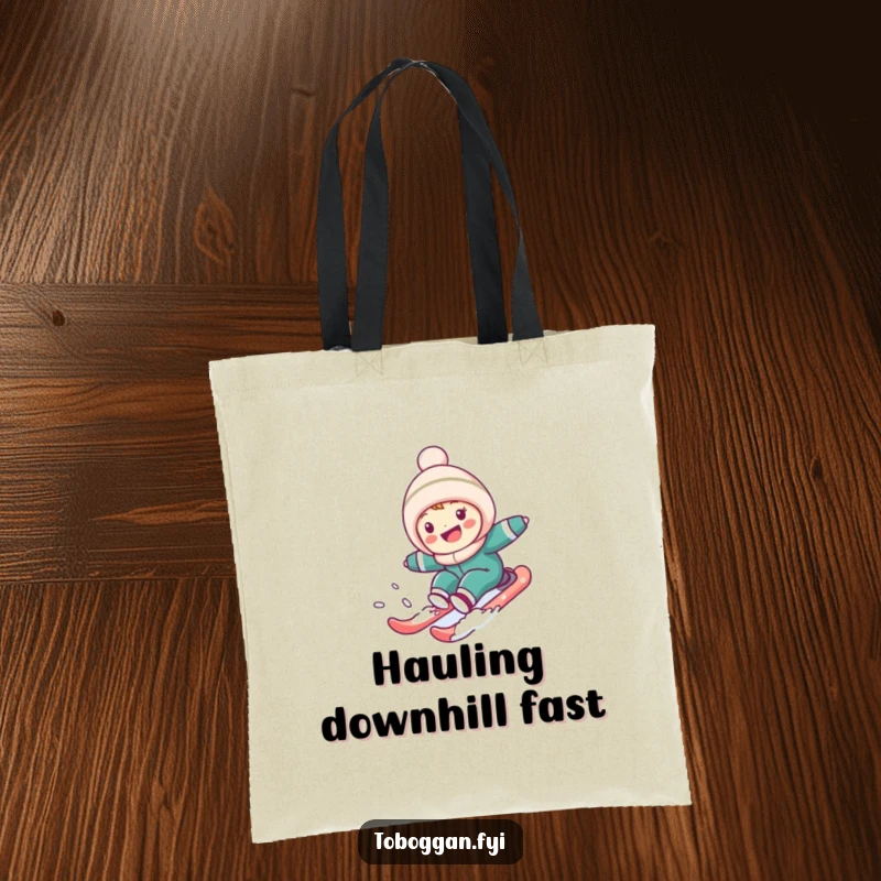Funny Tote Bag: Cute character gleefully sledding down a snowy hill, perfect for carrying items with a touch of winter humor.