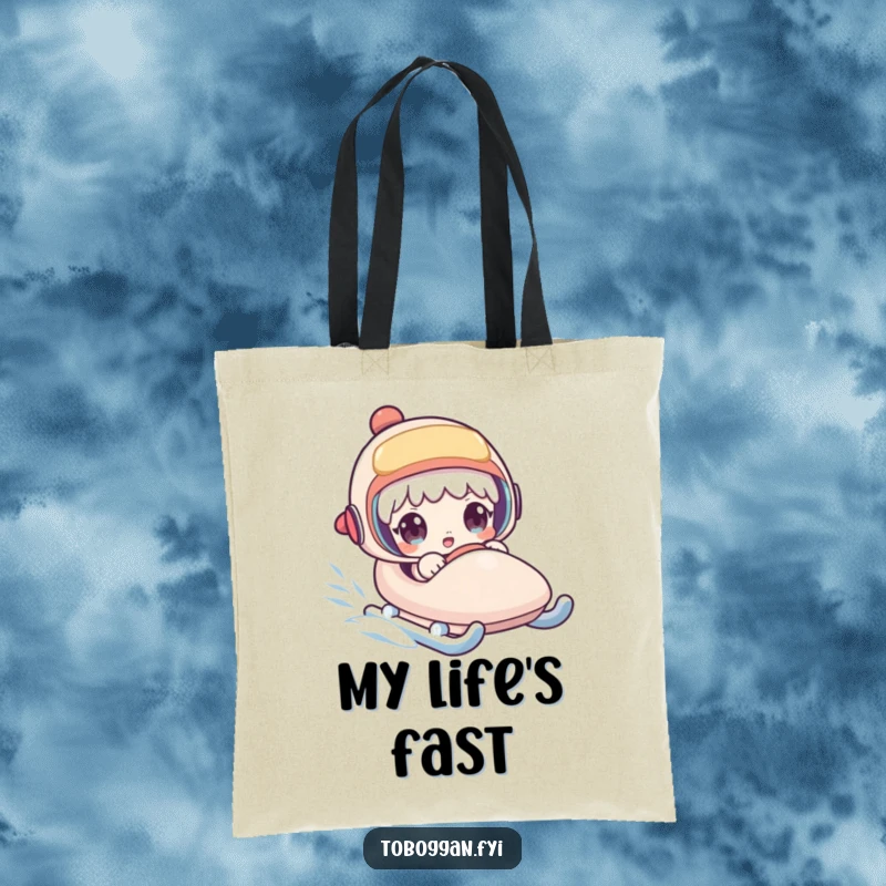 Funny tote bag capturing a character's surprised face on a rapidly accelerating sled, ideal for carrying daily items with humor.