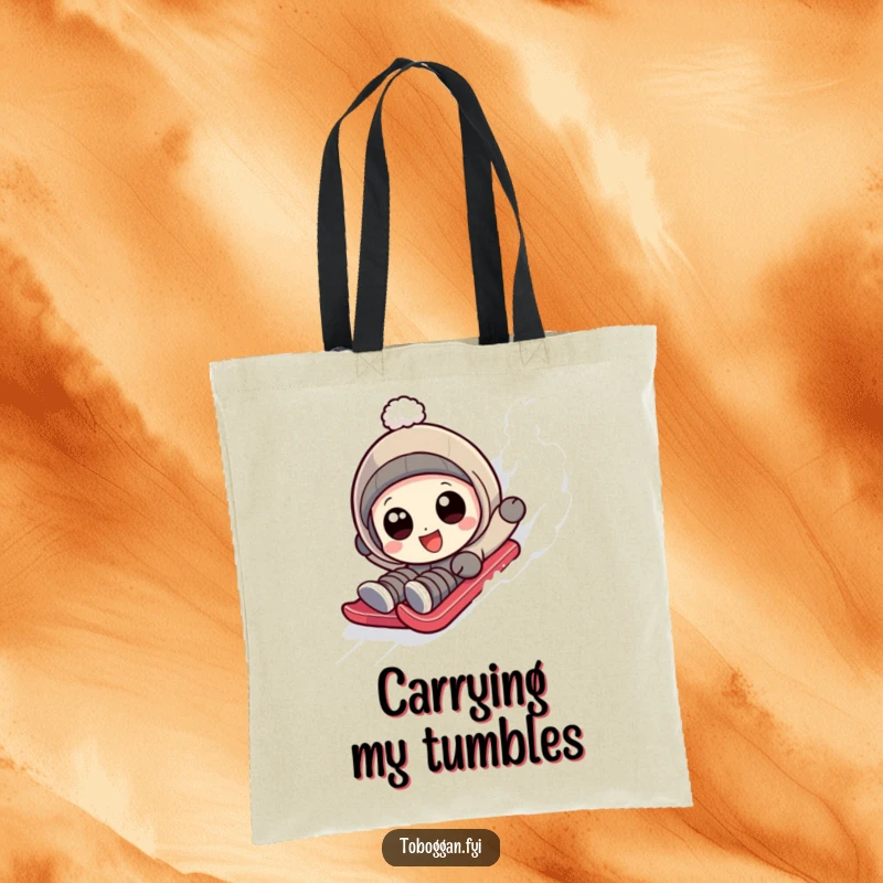 Funny character with wide, happy eyes hilariously tumbling down a sledding slope on a tote bag.