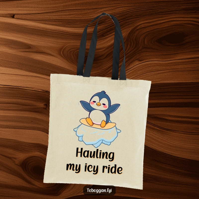 Funny Penguin Tote Bag: A confused penguin character attempts to surf a giant snowflake, making it a whimsical and humorous accessory.