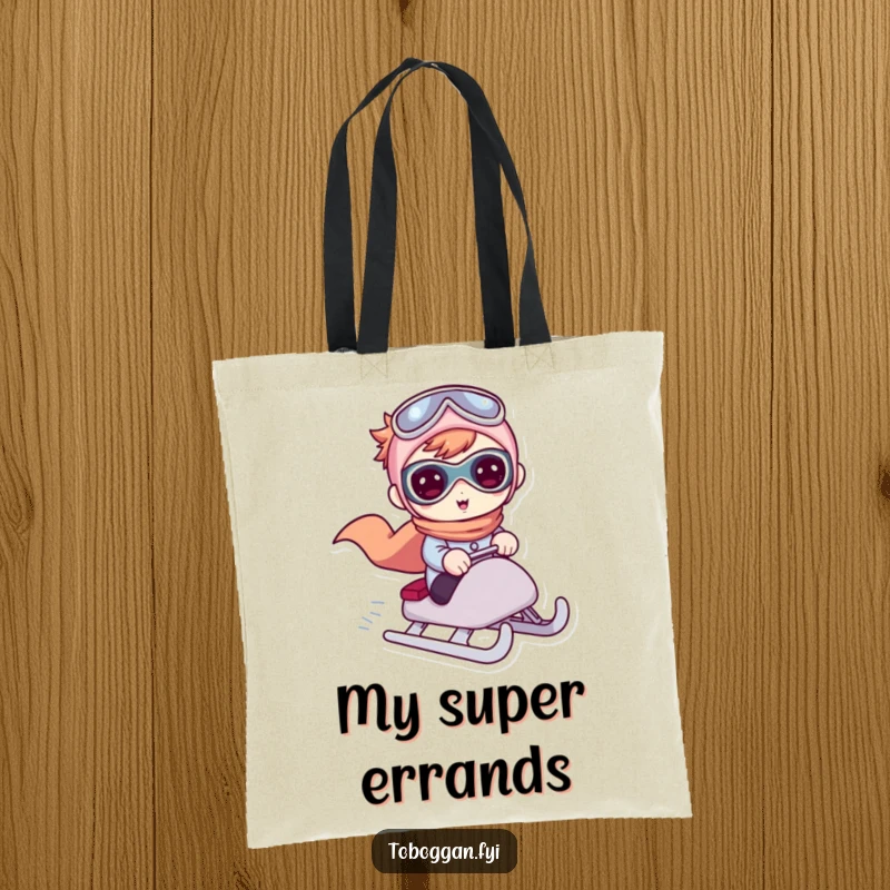 Funny tote bag featuring a cute character acting like a superhero while riding a sled, perfect for winter excursions.